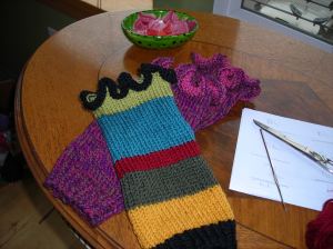 Little pink legwarmers with one of the striped ones on top.